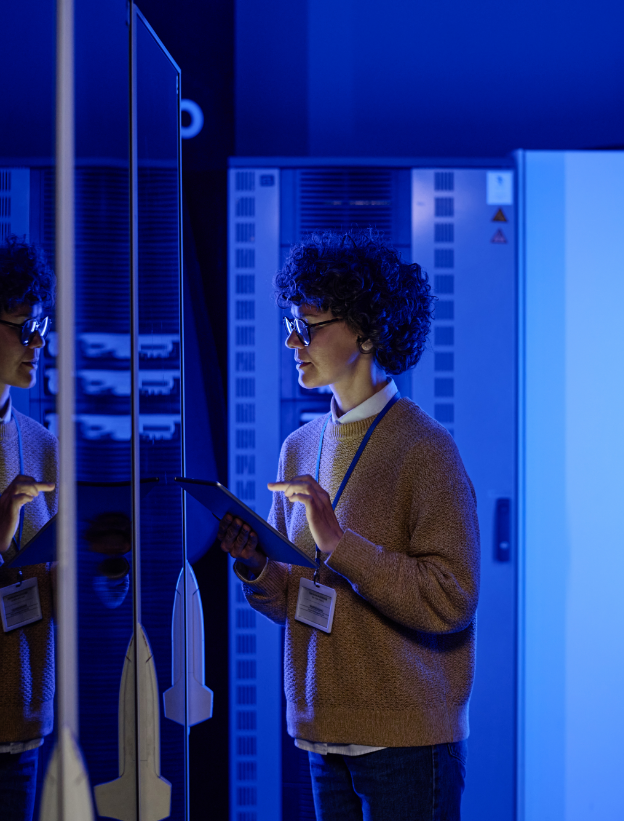 female it engineer working server room